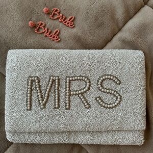 Mrs. Clutch with pink earrings